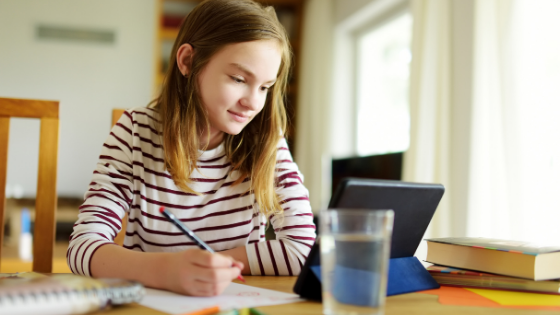 distance learning, school-age child at desk, child virtual learning, homeschooling